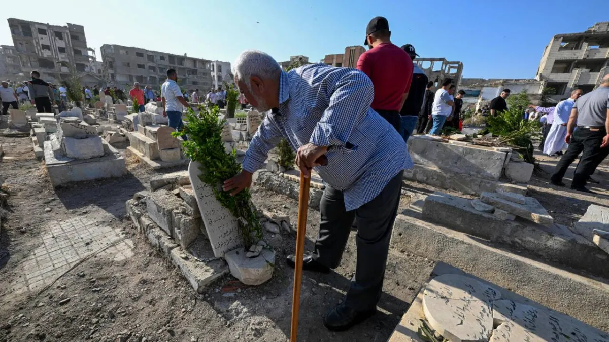 In Syrias Devastated Jobar Cemetery Comes Alive for Eid